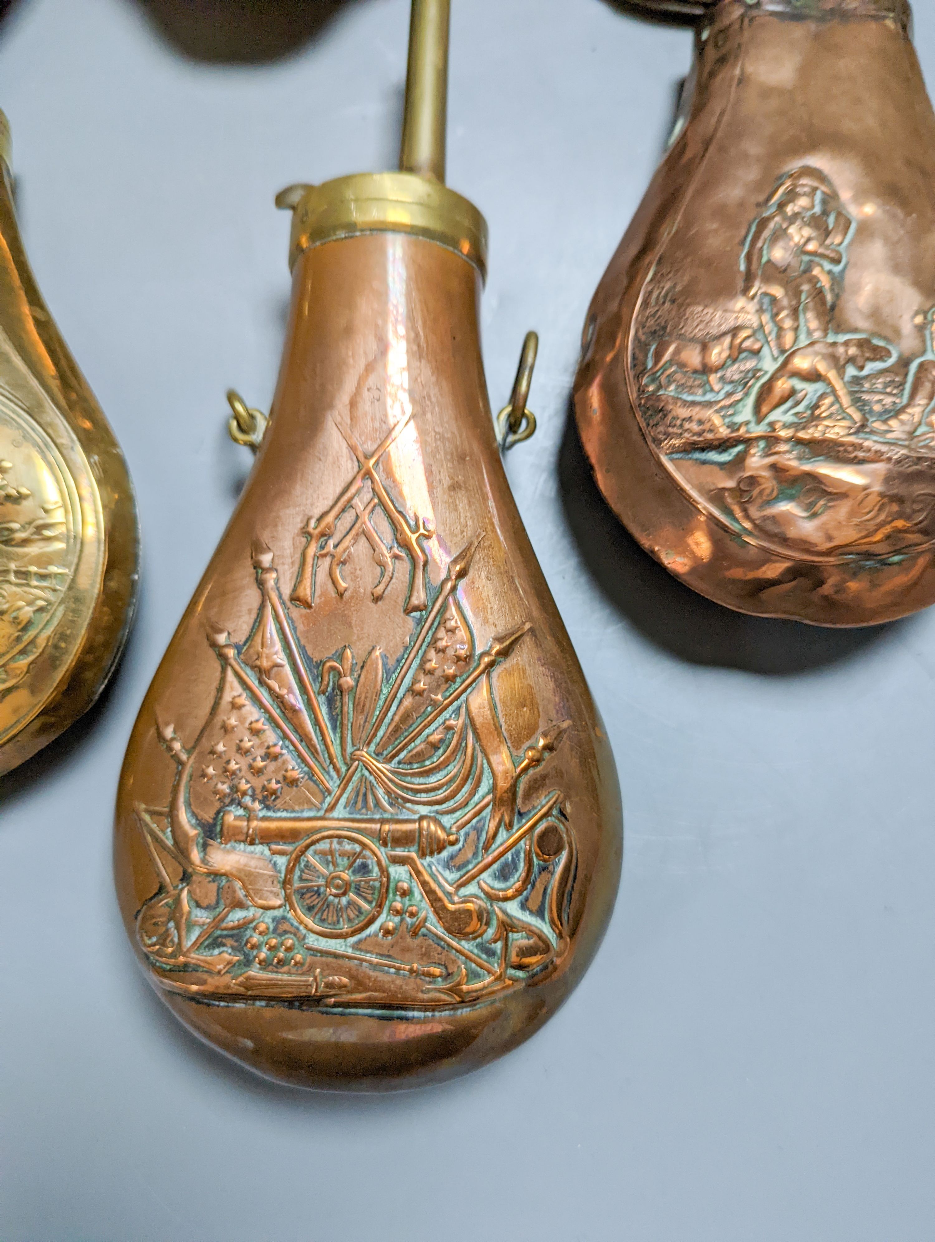 Eight assorted 19th century copper shot flasks